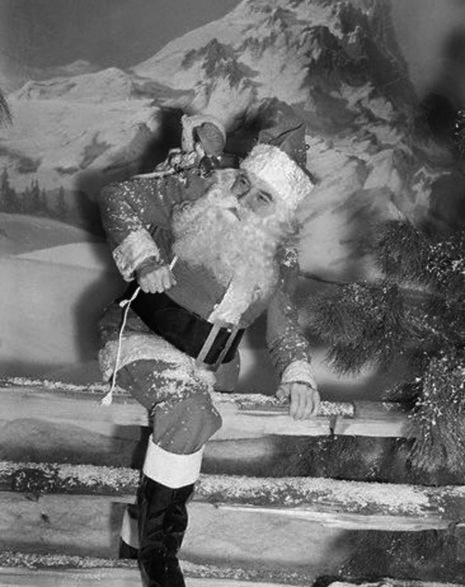 Bela Lugosi as Santa Climbing Over Fence